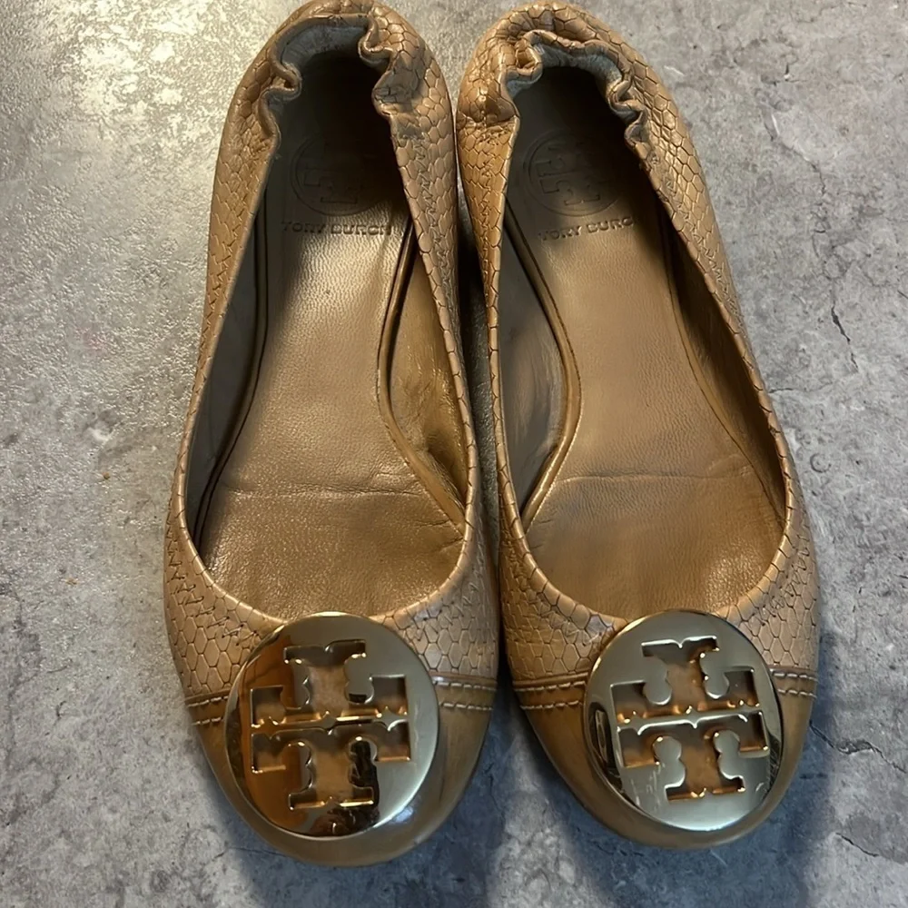 Tan Tory Burch flats with gold emblem